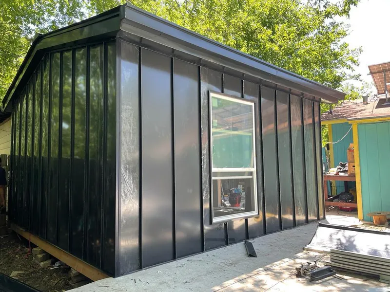 Black standing seam metal wall panels for Roof Inspection in New Baltimore